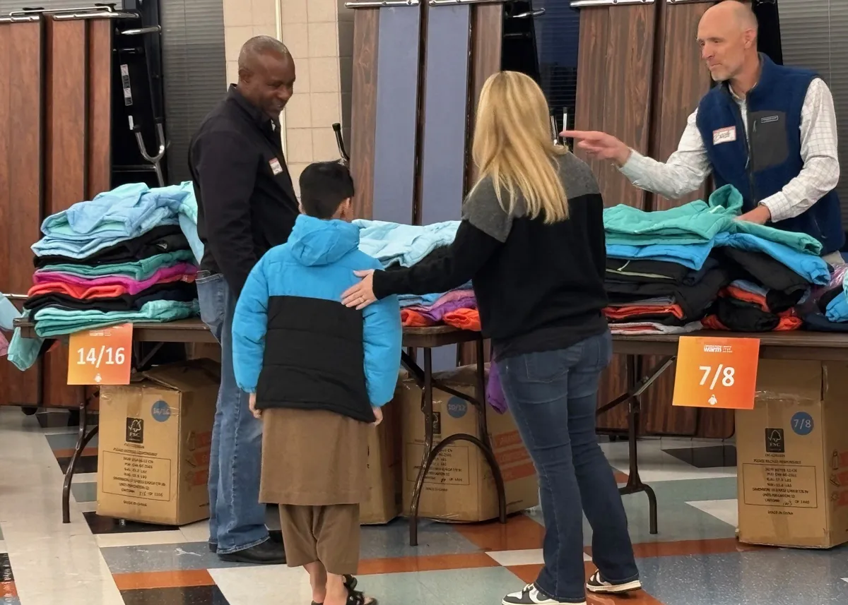 kid shopping new donated coats